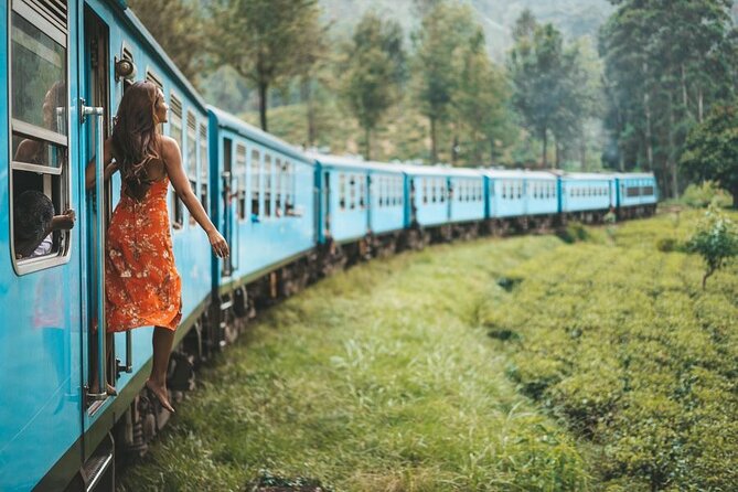 Traveler aboard Sri Lanka’s blue hill-country train